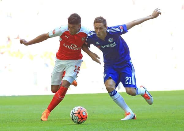 Arsenal's Alex Oxlade-Chamberlain (left) and Chelsea's Nemanja Matic battle for the ball during the FA Community Shield. But who has the better kit? (Picture: Nigel French/PA Wire)