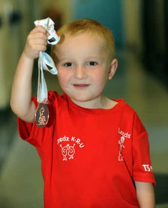 Reuben Gerard, three, with his bronze medal for the 25m sprint at the recent British Transplant Games. Picture by Gary Longbottom.