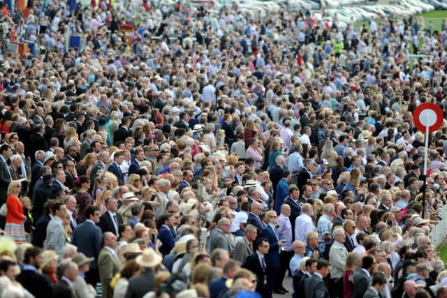 Date:19th August 2015. Picture James Hardisty (JH1009/94a)
Welcome to Yorkshire York Races Ebor Festival 2015. Pictured A packed Ebor Festival on the first day of racing.