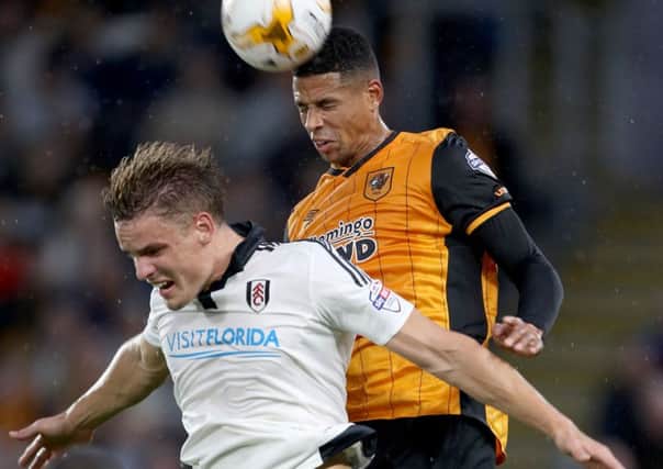 Hull City's Curtis Davies (right) battles for the ball with Fulham's Matt Smith. (Picture: Richard Sellers/PA Wire).