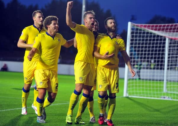 Leeds celebrate Mirco Antenucci's penalty goal.
