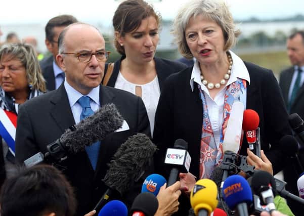 Interior Minister Bernard Cazeneuve with Home Secretary Theresa May at the Port of Calais