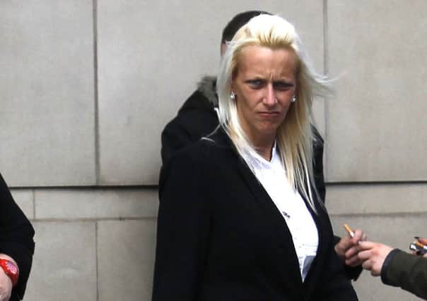 Carly Harris, leaves Belfast Coroner's Court, following the inquest of her husband Rifleman Dale Harris and Lance Corporal David Gwilt who both died when their car failed to stop at a junction in Co Antrim and ploughed into a tractor driving on a main road. PRESS ASSOCIATION Photo. Picture date: Friday August 21, 2015. The 24-year-olds had been serving in the 2nd Battalion The Rifles, based at Thiepval barracks, Lisburn. One of their colleagues - Rifleman Matthew Robins - managed to escape major injury in the collision on the Ballyconnelly Road near Cullybackey last August. See PA story ULSTER Crash. Photo credit should read: Peter Morrison/PA Wire