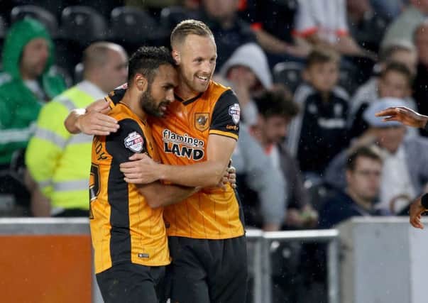 Hull City's Ahmed Elmohamady (left) celebrates scoring his side's first goal of the game with teammate David Meyler
