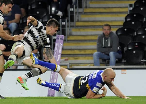 Carl Ablett touches down for the Rhinos' second try.
 Picture: Bruce Rollinson.