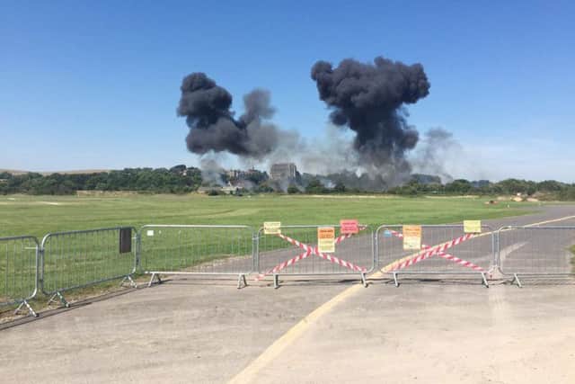 The scene as plane crashes near Shoreham Airshow. Photo: @NDH37087/PA Wire