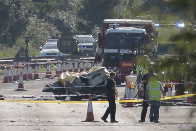 Emergency services attend the scene on the A27 as seven people have died after a plane crashed into cars on the major road during an aerial display. Photo: Daniel Leal-Olivas/PA Wire