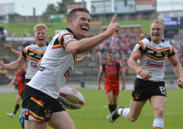 Bradford Bulls' Jake Mullaney celebrates after scoring a try against Salford. Picture: Anna Gowthorpe