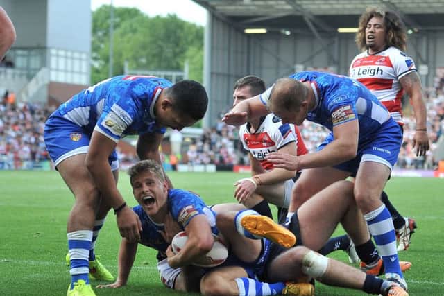 Wakefield Trinity Wildcats' Jacob Miller scores his side's third try against Leigh.