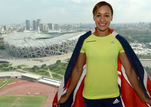 Great Britain's Jessica Ennis-Hill poses for photographs with the Union Flag during a press conference at the Ling Long tower, on day three of the IAAF World Championships at the Beijing National Stadium, China. (Picture: Martin Rickett/PA Wire).