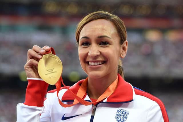 Jessica Ennis-Hill celebrates with her gold medal during the presentation ceremony for the women's heptathlon at the World Championships in China. Photo: PA.