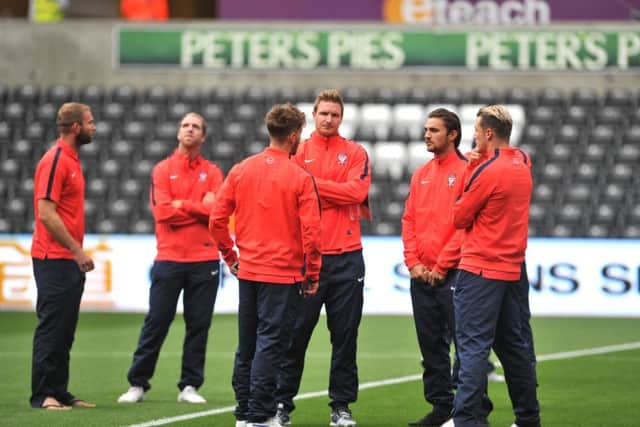 York City players on the pitch before the Capital One Cup, second round match at the Liberty Stadium, Swansea.