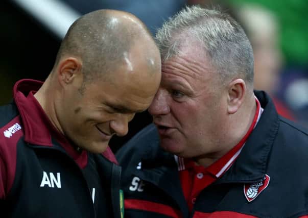 Rotherham United manager Steve Evans (right) and Norwich City manager Alex Neil during the Capital One Cup, second round match at the New York Stadium.