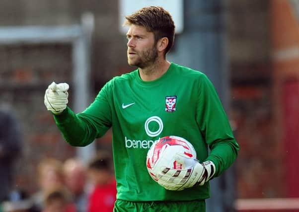 York City's goalkeeper Scott Flinders made a good early save but the rebound was swept in by Swansea (Picture: Tony Johnson).