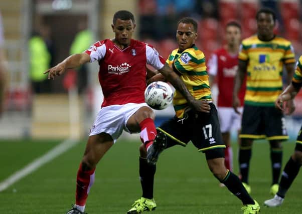 PRESSING CLAIMS: Rotherham Uniteds Jonson Clarke-Harris, left, battles with Norwich Citys Elliott Bennett at the New York Stadium.