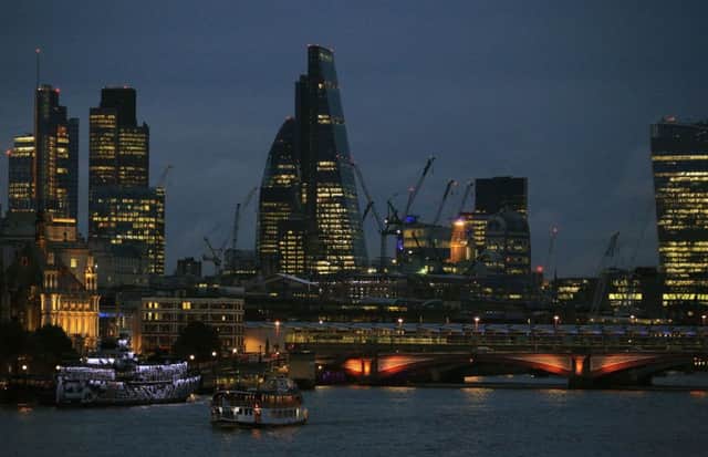 The City of London skyline at dusk, with Blackfriars Bridge in the foreground.  Photo: Jonathan Brady/PA Wire