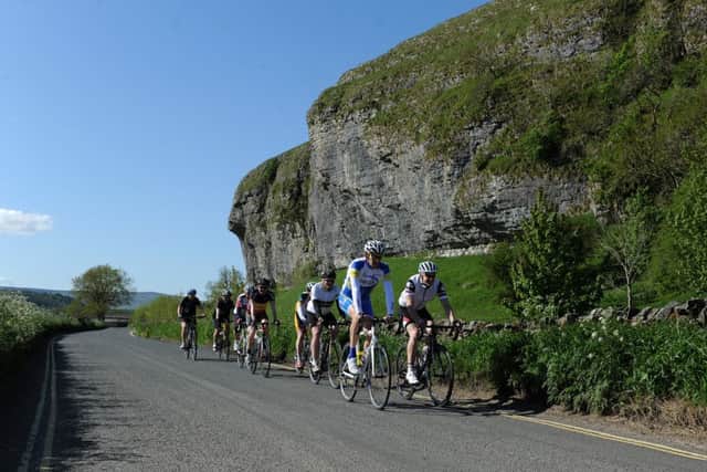 Cycol Rendezvous Tour guest  riders pass Kilnsey Crag during a preview ride of the first stage of the 2014 Tour de France from Skipton which took in Kidstones and Buttertubs passes. Picture Bruce Rollinson