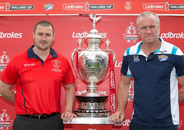 Challenge Cup Live: Hull KR head coach Chris Chester (L) and Leeds Rhinos head coach Brian McDermott (R) pictured with the Ladbrokes Challenge Cup Trophy.