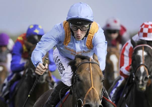 G Force and Daniel Tudhope win the Betfred Sprint Cup at Haydock in 2014.