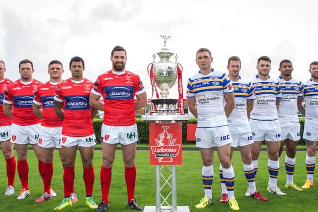 (From left) Hull KR players, Josh Mantellato, Graeme Horne, Shaun Lunt, Ben Cockayne, Kieran Dixon, Tyrone McCarthy and Leeds Rhinos players, Kevin Sinfield, Danny McGuire, Tom Briscoe, Kallum Watkins, Brett Delaney, Adam Cuthbertson are pictured with the Ladbrokes Challenge Cup Trophy ahead of the Final.