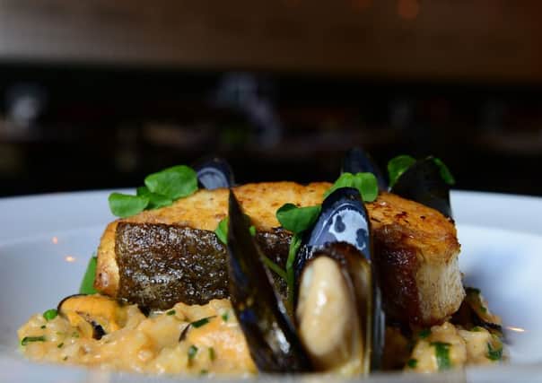 Halibut on seafood risotto.