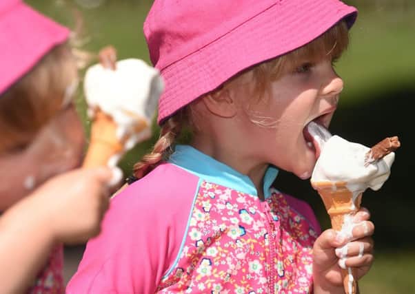 Twins Isabelle (left) and Charlotte Abercrombie, aged three, enjoying ice creams in Stratford-upon-Avon. Ice cream fans could soon savour a slower-melting treat on a hot day thanks to a new ingredient developed by scientists.