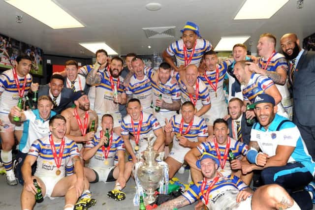 Leeds Rhinos players and staff celebrate in their dressing room at Wembley after comprehensively defeating Hull Kingston Rovers to win the Challenge Cup for a second straight season. (Picture: Steve Riding)