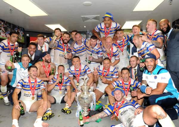 Leeds Rhinos players and staff celebrate in their dressing room at Wembley after comprehensively defeating Hull Kingston Rovers to win the Challenge Cup for a second straight season. (Picture: Steve Riding)