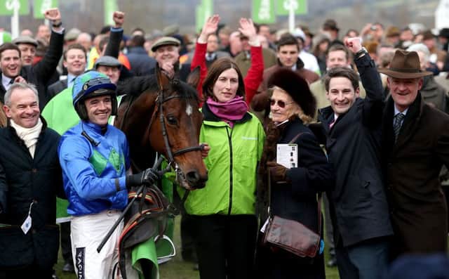 Jockey Ruby Walsh with Hurricane Fly after winning the Stan James Champion Hurdle Challenge Trophy at the 2013 Cheltenham Festival