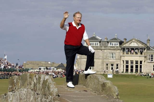 Jack Nicklaus waves spectators from the Swilcan Bridge during the Open Championship at St Andrews in 2005 (Picture: Andrew Milligan/PA).