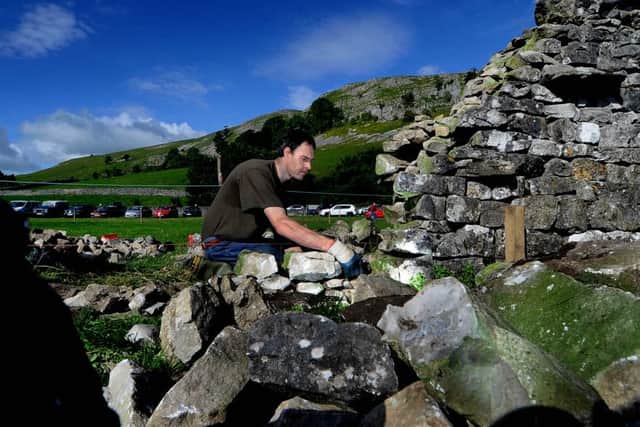 Martin Wilson, from Threshfield, taking part in the dry stone wall demonstration. (JH1010/09a)