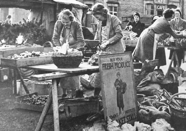 Members of Malton WI set up their market stall in the 1940s. Credit Amberley Publishing.