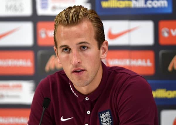 Harry Kane says it can only be benificial to him playing alongside Wayne Rooney up front for England (Picture:Joe Giddens/PA).
