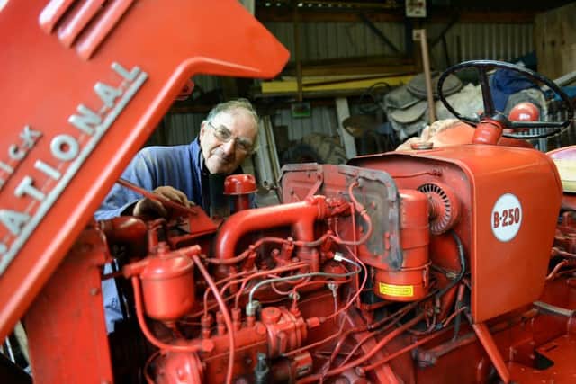 David Robinson working on the engine of his 1956 International B250 vintage tractor. (GL1007/19f)