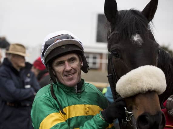 Tony McCoy with Mr Mole after wining The Betfair Price Rush Steeple Chase Race during Betfair Super Saturday at Newbury Racecourse, Newbury. PRESS ASSOCIATION Photo. Picture date: Saturday February 7, 2015. Tony McCoy today announced he is to retire from racing at the end of the season. See PA Story RACING McCoy. Photo credit should read: Julian Herbert/PA Wire