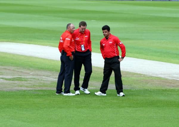 Umpire Rob Bailey, centre, with colleagues Tim Robinson, left, and Aleem Dar.