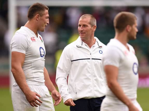 England's Sam Burgess chats with head coach Stuart Lancaster after beating Ireland 21-13. Picture: Andrew Matthews/PA.