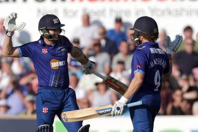 Gloucestershire's Michael Klinger, left, and Hamish Marshall celebrate after their side's victory at Headingley on Sunday.