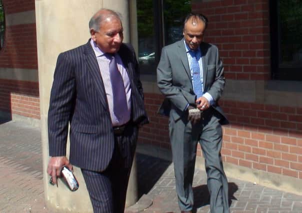 Restaurant owner Mohammed Zaman (right) leaving Teesside Crown Court