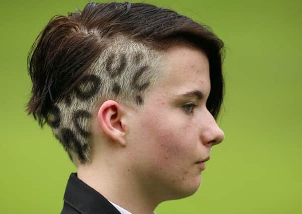 Lauren Mcdowell, 13, with her leopard-print hairstyle. Mum Yvonne Mcdowell, 34, has complained her exclusion from school breaches her daughter's human rights. Picture: Ross Parry Agency