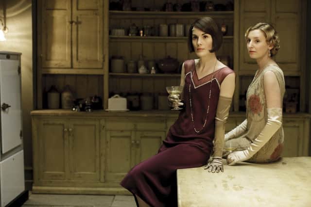 MICHELLE DOCKERY as Lady Mary Crawley and LAURA CARMICHAEL as Lady Edith Crawley