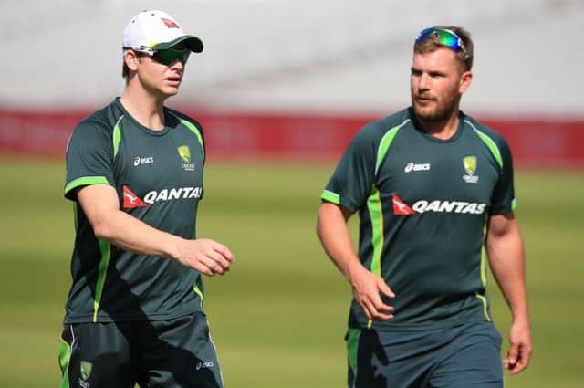 Australia's captain Steve Smith (left) with teammate Aaron Finch at The Emirates Old Trafford, Manchester. PRESS ASSOCIATION Photo. Picture date: Monday September 7, 2015. See PA story CRICKET Australia. Photo credit should read: Nick Potts/PA Wire. RESTRICTIONS: Editorial use only. No commercial use without prior written consent of the ECB. Still image use only no moving images to emulate broadcast. No removing or obscuring of sponsor logos. Call +44 (0)1158 447447 for further information.