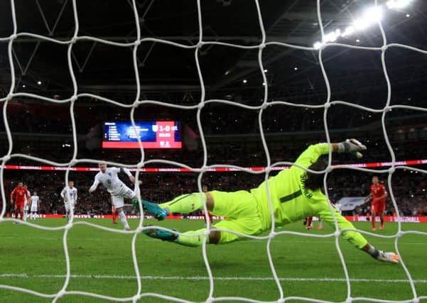 England's Wayne Rooney scores his sid'es second goal against Switzerland and his 50th for England (Picture: Nick Potts/PA Wire).