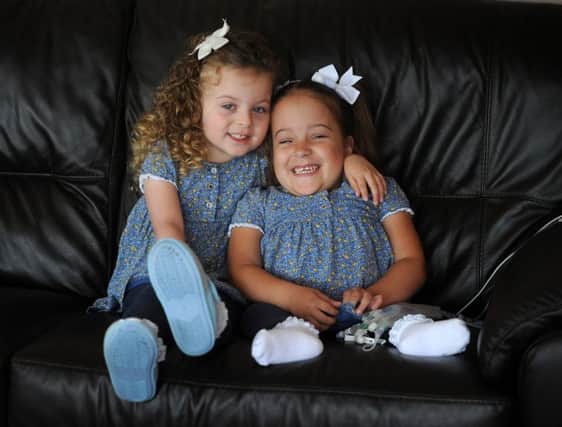 Four year old Matilda Booth has been nominated for a Yorkshire Children of Courage award, pictured here with her twin sister Layla  Picture by Simon Hulme