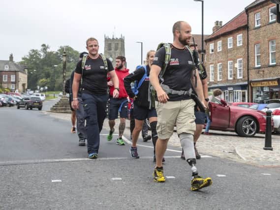 Several ex-servicemen and women injured in combat walk from Edinburgh to Buckingham Palace. They were greeted on their way by the Mayor of Beadale and members of RAF Leeming en route. Photo:  Phil Dye.