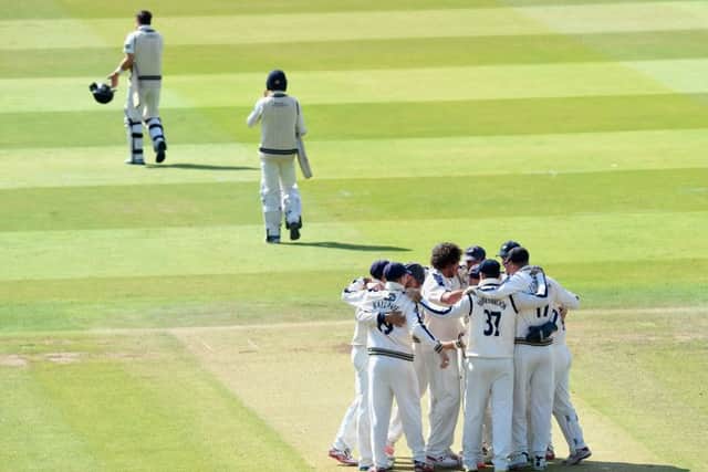 Ryan Sidebottom of Yorkshire is mobbed by team-mates after claiming his fifth wicket by bowling Tim Murtagh at Lord's.  (Photo by Mike Hewitt/Getty Images)