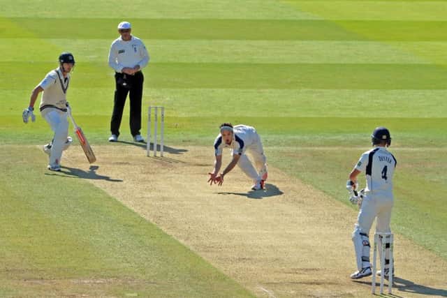 Yorkshires Jack Brooks closes his hands around the ball to accept a return catch off his bowling from Middlesexs Neil Dexter (Picture: Tony Johnson).