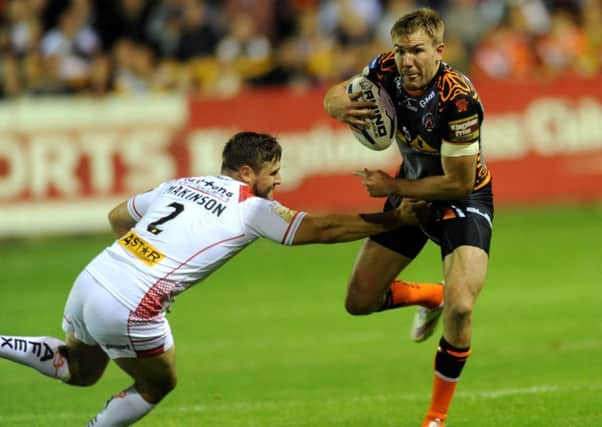 NOT QUITE: Castleford 
Tigers' captain  Michael Shenton is tackled by Saints Tommy Makinson. 
Picture: Jonathan Gawthorpe.