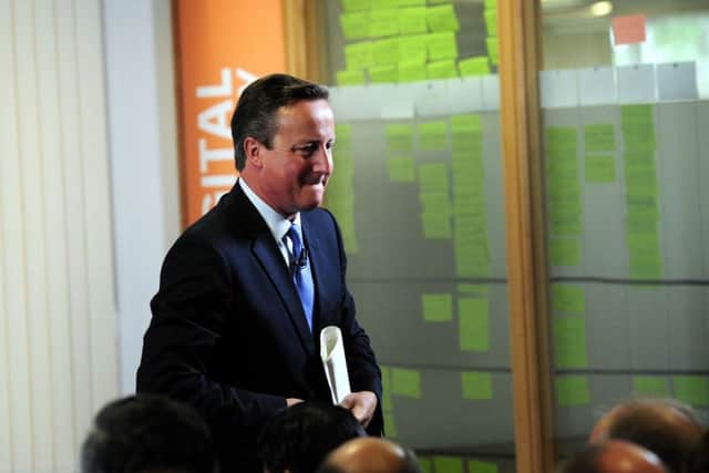David Cameron leaves the stage after his speech in Leeds