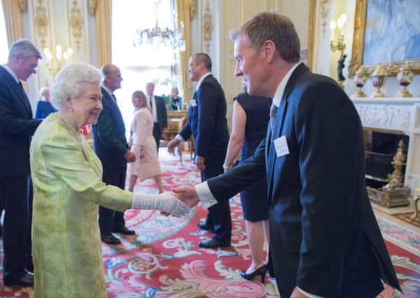 HM The Queen receiving Ancon managing director Stuart Maxwell